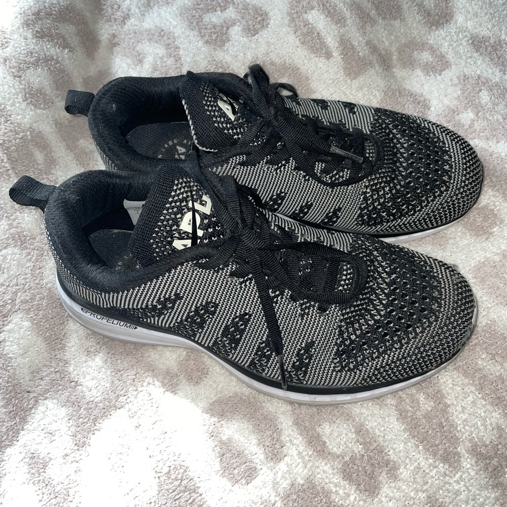 Black and White APL sneakers. Lightly worn